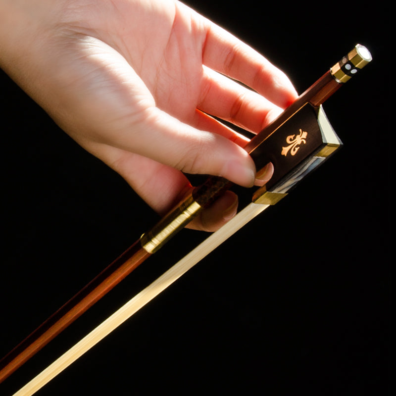 Close-up of Ebony Frog – detailed view of ebony frog with abalone inlay on Brazilwood violin bow
