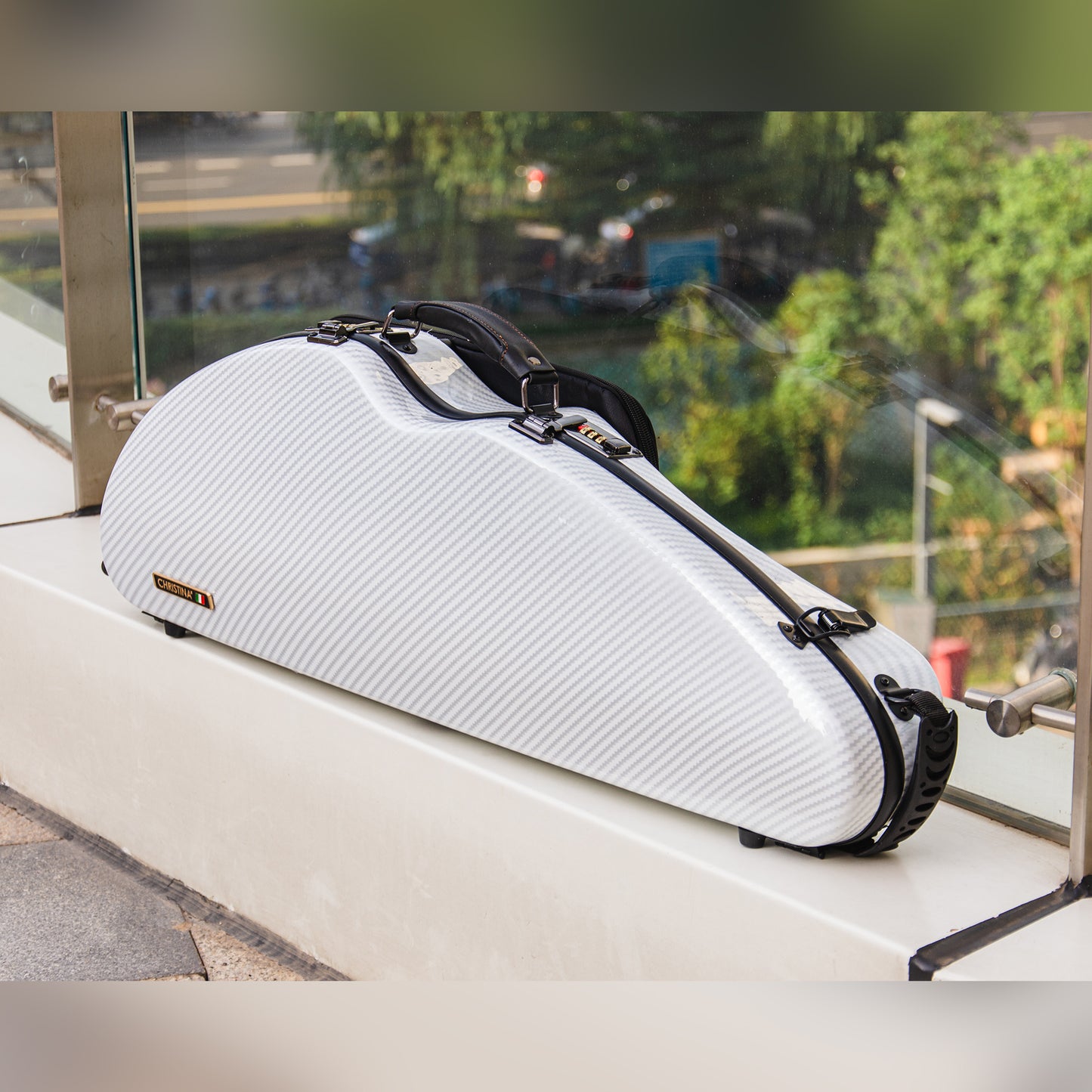 Front angle view of waterproof 4/4 violin case polycarbonate with modern wood grain finish