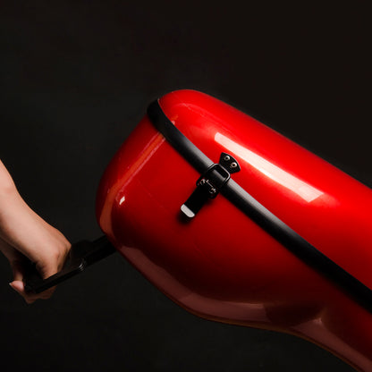 Close-up of portable cello travel case with glossy red finish and lightweight hard shell design