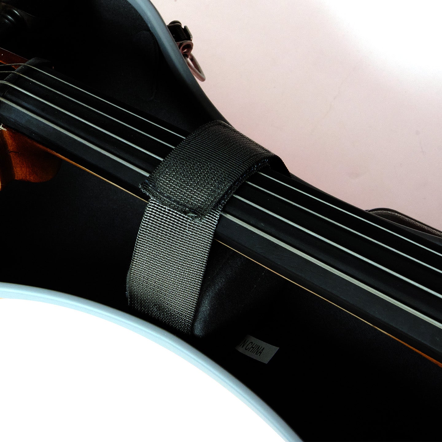 Interior detail of waterproof 4/4 cello case with wheels and soft padded protection system