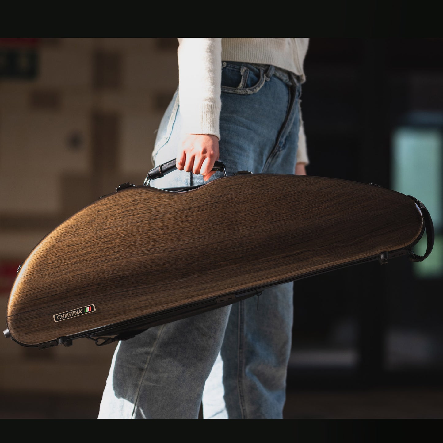Close-up of premium wood grain texture on 4/4 violin case polycarbonate exterior shell