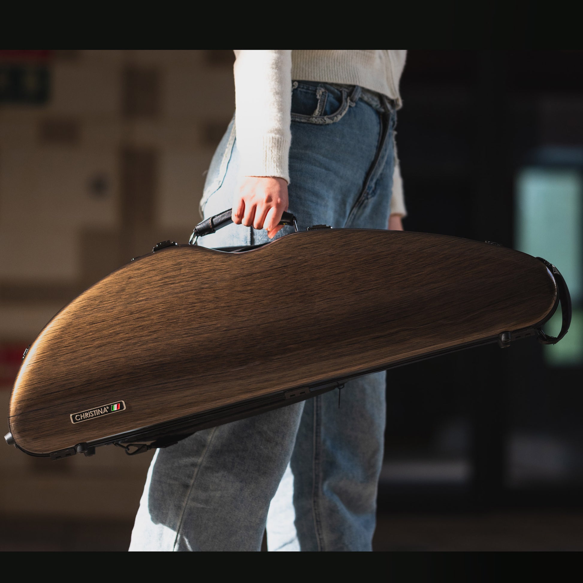 Close-up of premium wood grain texture on 4/4 violin case polycarbonate exterior shell